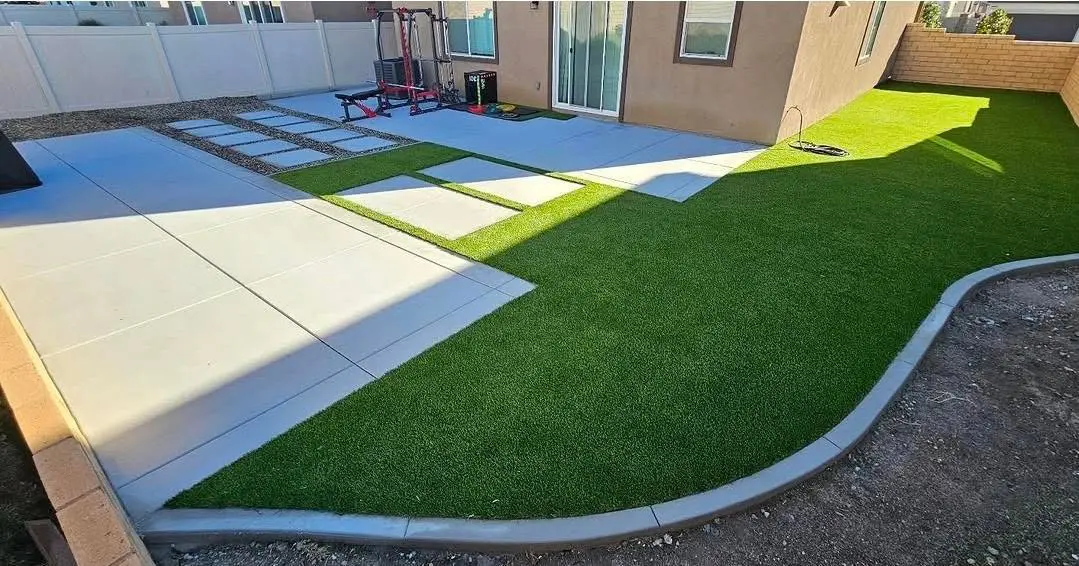 Finished backyard turf and concrete patio installation