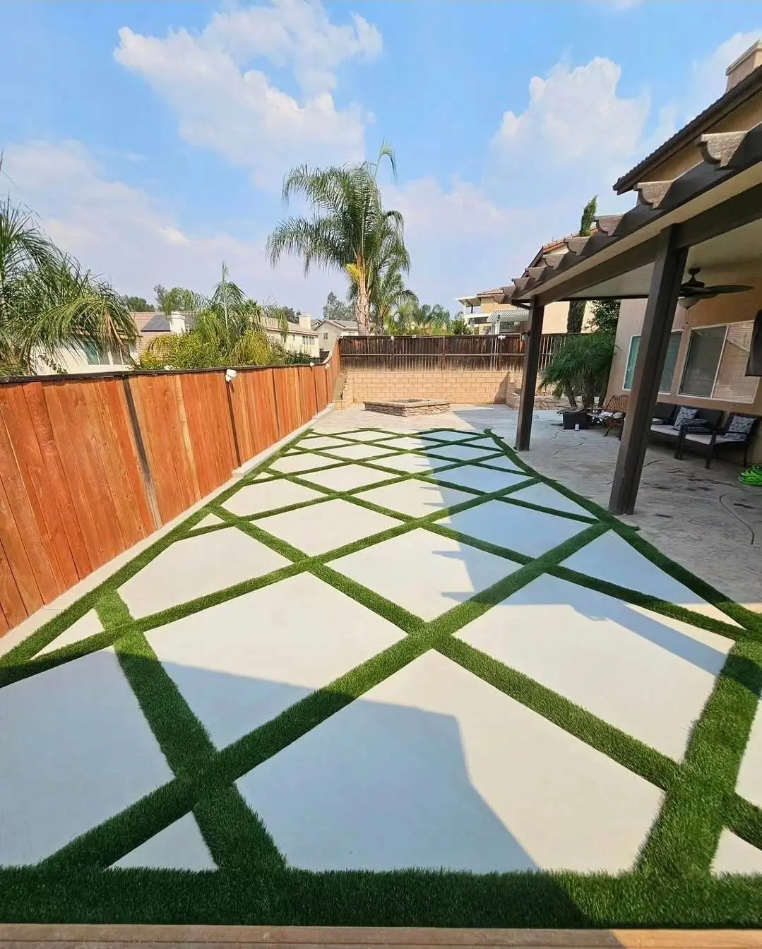 Geometric concrete patio with artificial turf joints