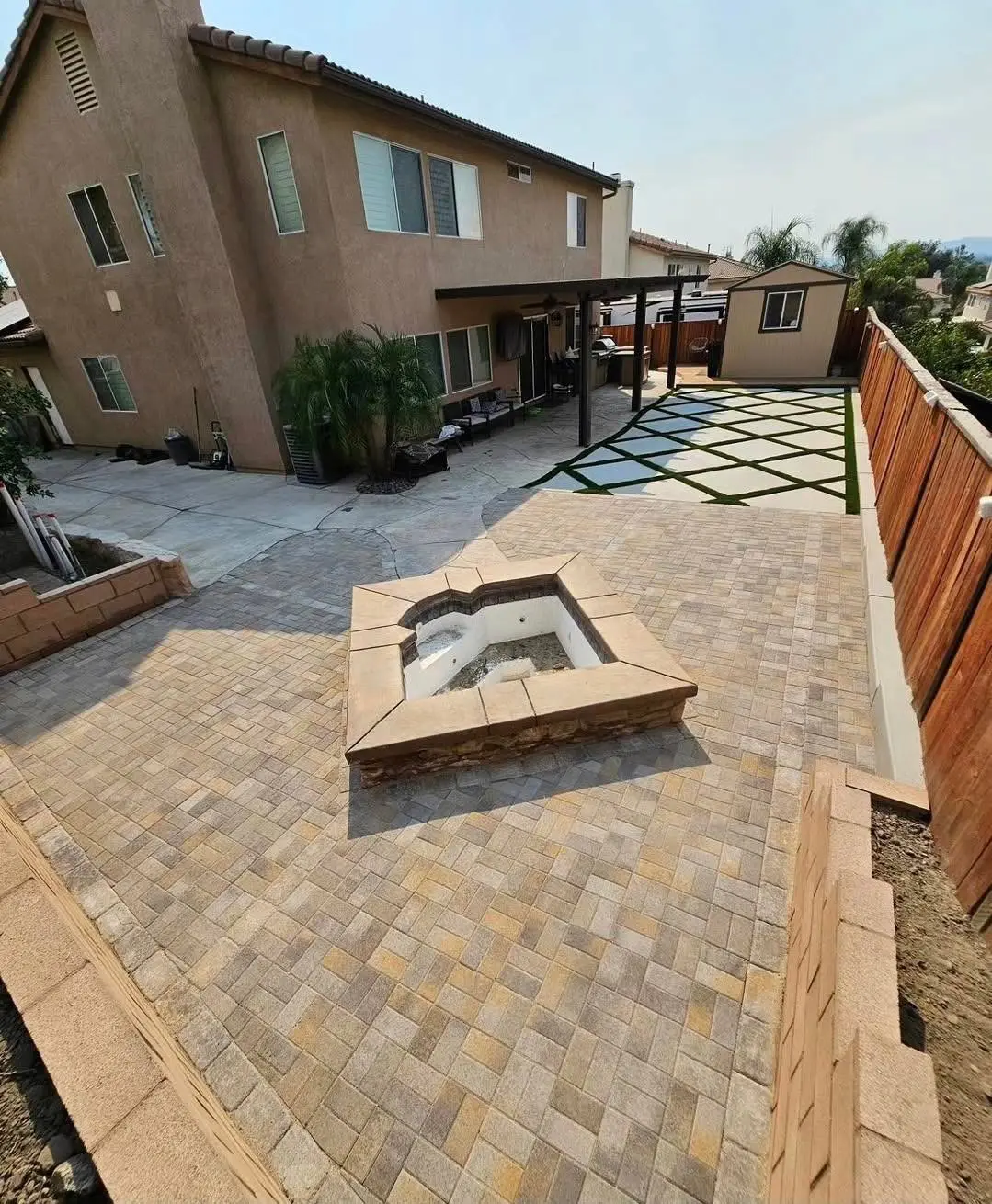 Large completed backyard hardscape and artificial turf project